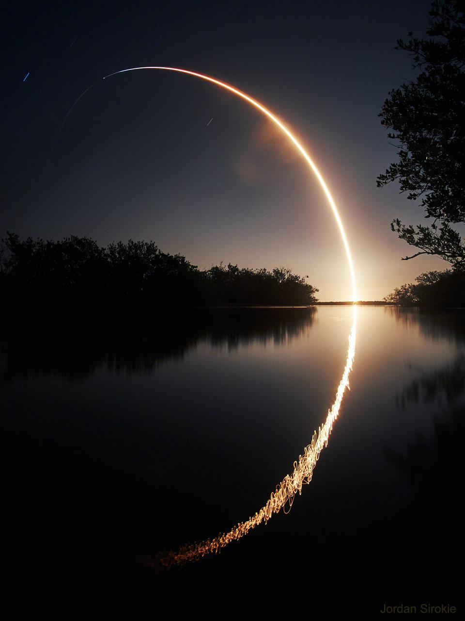 The featured image shows a long exposure image of 
the launch of NASA's IXPE observatory to low Earth orbit.
The launch was on a Falcon 9 Rocket by SpaceX.
Please see the explanation for more detailed information.